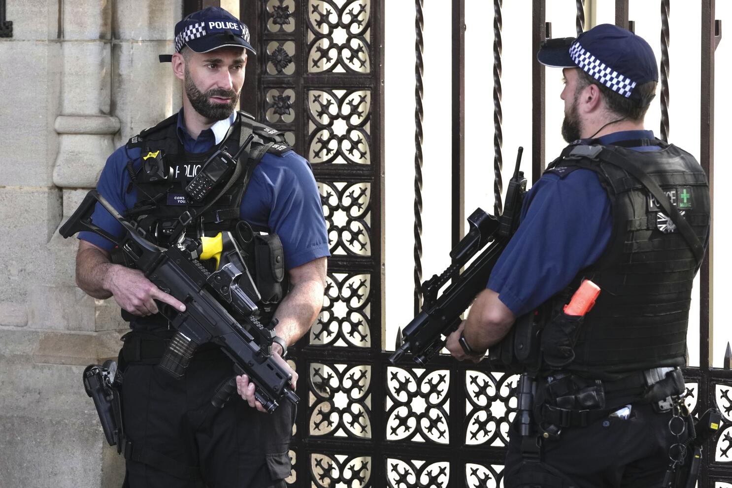London police call for backup as armed officers lay down guns
